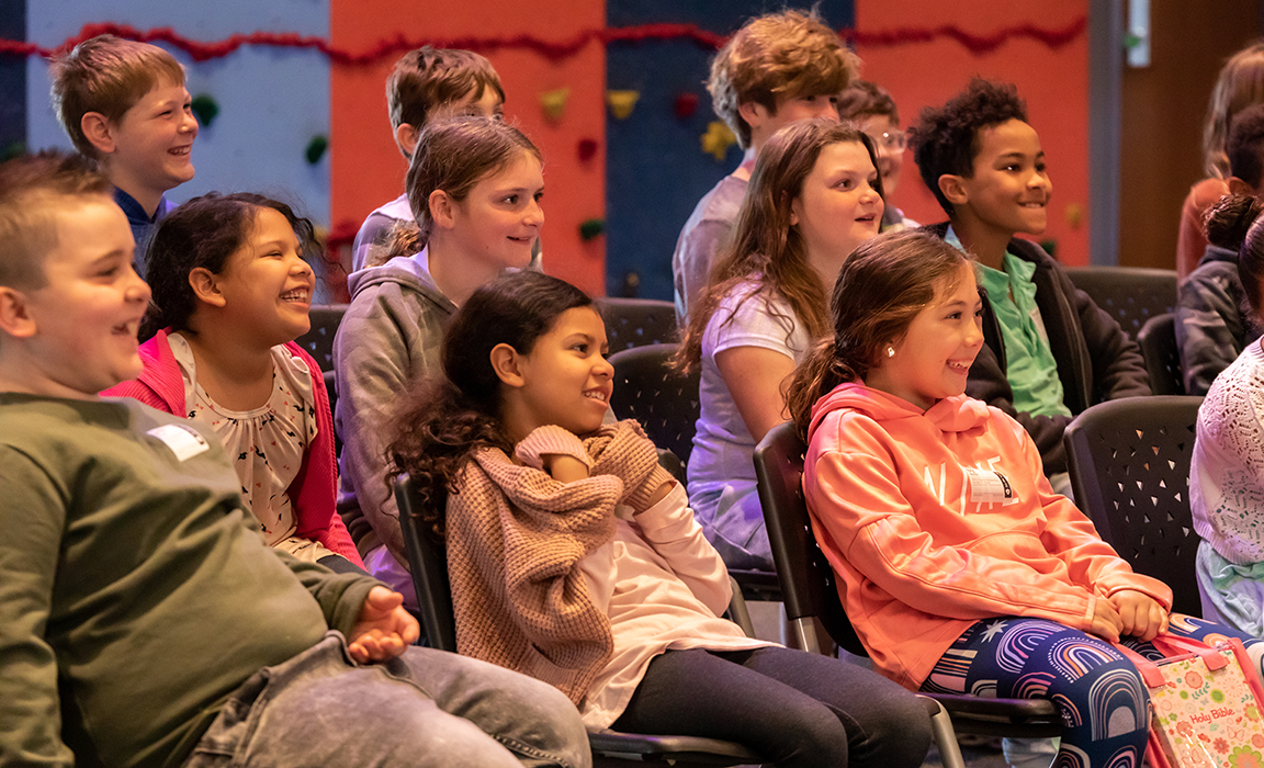Kids running in an easter egg hunt.